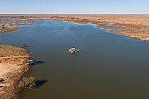 Aerial view of the Cooper Creek Crossing with a "punt" or ferry servicing the vehicle driving public to cross the road, South Australia, June 2011