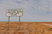 Sign saying 'Welcome to Lake Eyre Basin sign. William Creek catchment area' South Australia. July 2011