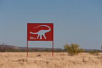 Dinosaur cutout signs in outback, Queensland, Australia, July 2011