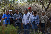 Maltese BirdLife members taking a tour of Ghadira Nature Reserve, led by warden, Ray Veller, during BirdLife Malta Springwatch Camp, Malta, April 2013