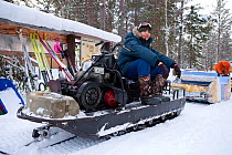 Man on Ski-doo snowmobile, Arctic circle Dive Center, White Sea, Karelia, Northern Russiam, February 2010