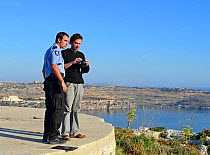 Nick Barbara and ALE Police officer reviewing video footage of illegal Turtle Dove trapping during BirdLife Malta Springwatch Camp April 2013