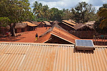 Solar panel on a corrugated iron rooftop in village, Miono region, Tanzania.