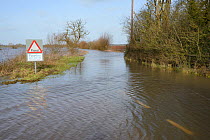 Severely flooded and closed road on Curry Moor between North Curry and East Lyng after weeks of heavy rain, Somerset Levels, UK, January 2013.