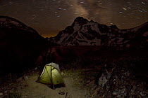 Camping tent at night in Sawtooth Lake area with Mount Regan on the skyline in the Sawtooth Wilderness.  Idaho, USA, July 2011