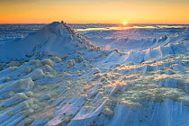 Sunrise over formations of ice and snow, caused by strong winds, Lake Peipsi, Eastern Estonia, December 2012.