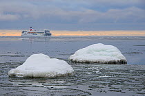Tallinn-Stockholm cruise ship beyond sea ice forming on the Baltic. Northern coast of Estonia, February 2013.