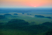 Sunrise over  mineral islands in the Muraka bog in Eastern Estonia. August 2011.