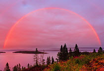 Rainbow over Snaasavatnet, at dusk, Nord-Tronelag, Norway, July.