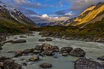 Mount Cook / Aoraki (height 3754m) in the late evening sun. View from Hooker Valley, Hooker River in the foreground. Aoraki/Mount Cook National Park, MacKenzie Country, South Canterbury, New Zealand,...