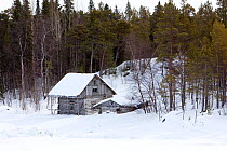 Wooden hut on the seashore, Arctic circle Dive Center, White Sea, Karelia, northern Russia March 2010