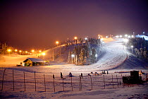 lluminated ski slopes at night, Ruka, Lapland, Finland