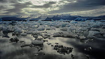 Timelapse of icebergs moving in Jokulsarlon glacial lagoon formed from meltwater from the retreating Vatnajokull glacier, Iceland, July 2012.