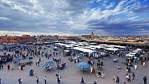 Timelapse from day to night with clouds forming, looking over Djemaa el-Fna market, Marrakech, Morocco, 2011.