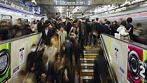 Timelapse of commuters entering and exiting trains at Shibuya Station at rush hour, Shibuya, Tokyo, Honshu, Japan, 2011.