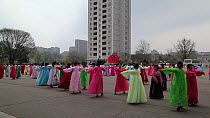 Women in traditional dress dancing during street celebrations on the 100th anniversay of the birth of President Kim Il Sung, Pyongyang, Democratic Peoples' Republic of Korea (DPRK), April 15th 2012.