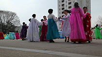 Women in traditional dress dancing during street celebrations on the 100th anniversay of the birth of President Kim Il Sung, Pyongyang, Democratic Peoples' Republic of Korea (DPRK), April 15th 2012.