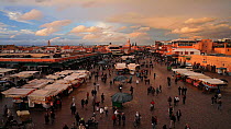 People visiting and walking through the Djemaa el-Fna market, Marrakech, Morocco, 2011.