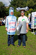 Friends of the Earth activists playing the parts of tap and bottle water in a competition between each, Gillespie Park Festival Highbury, London Borough of Islington, England UK, September 2009