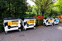 Recycling Bins painted with splodges like cows, Clissold Park, Stoke Newington London Borough of Hackney, England UK