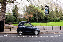 Electric car recharging at an Elektrobay Electric Vehicle Recharging Site in a designated parking bay, Highbury Fields, London Borough of Islington, England UK