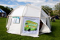 London Permaculture Network on green bus with Transition as it&#39;s destination printed on side of tent at London Green Fair (previously Camden Green Fair) England UK, June 2012