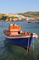 Fishing boat moored in Kokkari harbour. Samos, Greece, July.