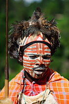 Kikuyu warrior wearing headress made of Helmeted Guineafowl feathers, Tomson Falls, Kenya. August 2010