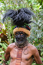 Clan chief at Paiya, Western Highlands with Cassowary head dress, Papua New Guinea. August 2011