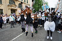 Dancers from the Artful Badger group, dancing in badger costumes, anti badger cull march, London 1st June 2013.