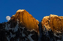 Moon rising from behind mountains, seen from Gore II camp (4,400m), Baltoro Glacier, Central Karakoram National Park, Pakistan, June 2007.