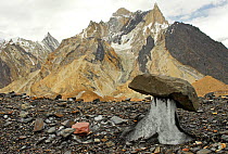 Rocks on the surface of the Baltoro Glacier, with mountains in the background, Central Karakoram National Park, Pakistan, June 2007.