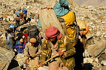 Group of Balti porters following a trail on the Baltoro Glacier, Central Karakoram National Park, Pakistan, June 2007.