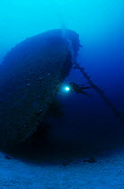 Cargo ship 'Nippo Maru' sunk in Operation Hailstone 17/18th February 1944. Diver on bow of ship. Chuuk Lagoon, Federated States of Micronesia