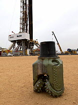 A land drilling rig with a tri-cone, insert Drilling Bit, exploring for oil near Lokichar, Kenya, March 2012