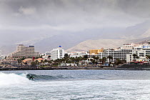 Man surfing, Playa de Las Americas, Tenerife, Canary Islands, Spain, March 2012.