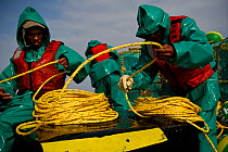 Fishing for West coast rock lobster (Jasus lalandii) aboard the James Archer (Oceana Fisheries). Fishermen pull up lobster traps in Saldanha Bay and St. Helena Bay, Western Cape, South Africa.