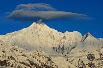 RF- Meili Snow mountain, with lenticular cloud above, Yunnan province, China, April 2011 (This image may be licensed either as rights managed or royalty free.)