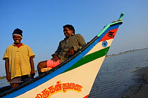 Fishermen in fishing boat, Pulicat Lake, Tamil Nadu, India, January 2013.