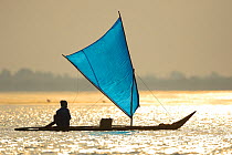 Fisherman on boat, Pulicat Lake, Tamil Nadu, India, January 2013.