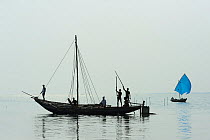 Fishermen in boats, Pulicat Lake, Tamil Nadu, India, January 2013.