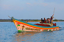 Fishermen in open boat on Pulicat Lake, Tamil Nadu, India, February 2013.