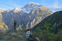 Tadjik guides looking for Brown Bear (Ursus arctos) Dashti Jum Reserve, Tadjikistan, April 2012