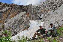 Tadjik guide with photographer Eric Dragesco in Brown Bear (Ursus arctos) habitat, Dashti Jum Reserve, Tadjikistan, April 2012