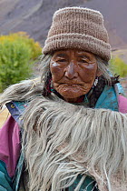 Old woman with Yak fur coat and rain coat, Shang Village, Hemis NP, at altitude of 4050m, Ladakh, India, October 2012