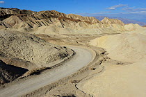 Eroded badlands landscape with road, Death Valley National Park, California, USA, November 2012