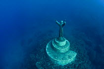 The statue of Christ Of The Abyss (Cristo degli abissi) in the Marine Protected Area of Portofino (Area Marina Protetta, Portofino), Liguria, Italy. Mediterranean Sea. This was the world's first under...