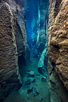 The narrow Nes Canyon, a fault filled with fresh water in the rift valley between the Eurasian and American tectonic plates in northern Iceland. May 2011.
