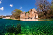 Medieval mill building, now partly flooded in Capodacqua lake. Gran Sasso National Park, Abruzzo, Italy.