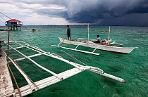 Guardtower and guardsman in bangka boats, Marine Protected Area, Bilang Bilangang East Island, Danajon Bank, Central Visayas, Philippines, April 2013